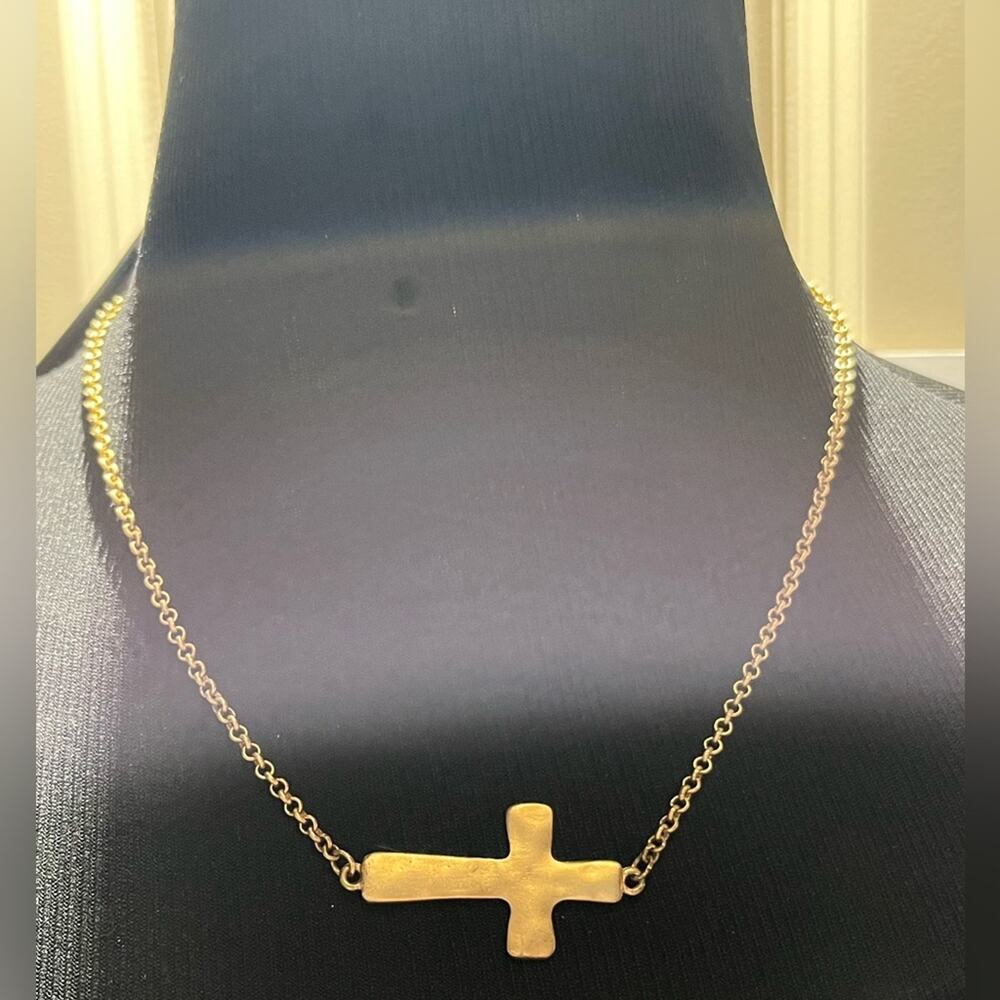 Gold tone sideways cross necklace
